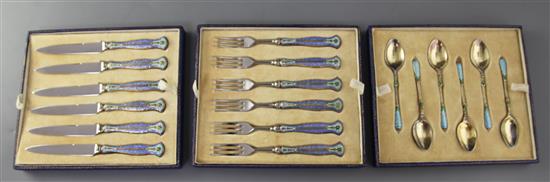 A cased set of six pairs of 1930s silver gilt and polychrome enamel handled stainless steel fruit eaters,